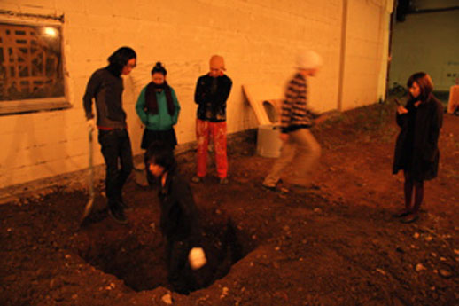 It took several interns several hours to dig the hole. While the performance piece might seem simple enough, the artist had to convince the landowner to rent him the lot for a week. He paid ¥80,000 for the week.