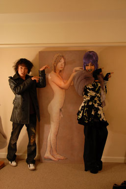 Artist Yoichi Umetsu and drag queen art partygoer Vivienne pose in Arataniurano's room.