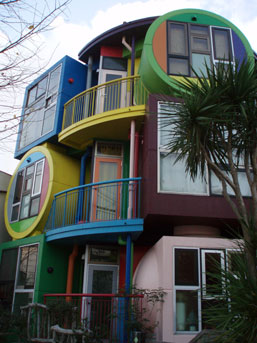 A jumble of cubes and spheres in bright primary colors. There are 9 units spread over three storeys.
