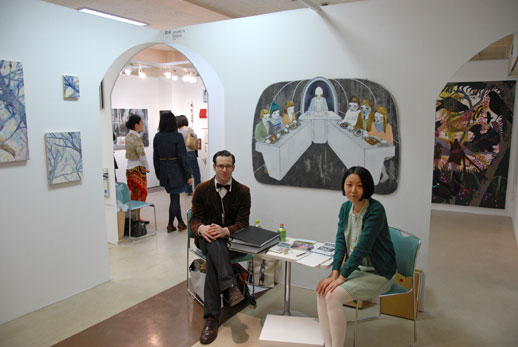 Jeffrey and Misako Rosen from Misako & Rosen (Tokyo) in front of a work by Maya Hewitt.