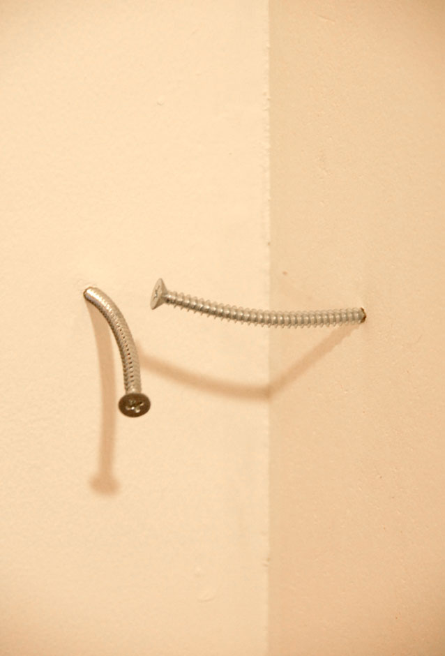 These two bent metal screws sticking out of the wall look like they are just static...