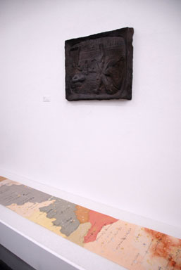 A black relief titled ''Doha'' and a scroll laid out.