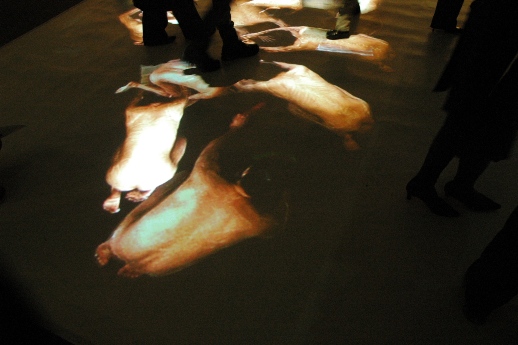 Images of naked figures flashed up on the ground.