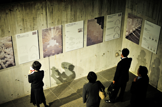 People enjoying the exhibition in the gallery courtyard, located on the fourth floor of the building.