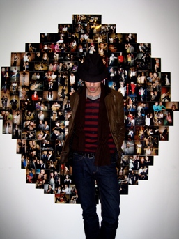 Rob Judges (artist and DJ) in front of the photo wall of Galle's last long stretch in Tokyo — a big wall of photos from various parties, some of which he organized himself (as Narziss, TFR).