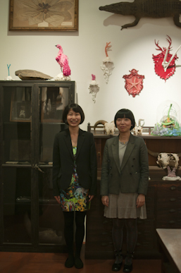 Two of the curators, Satoko Shibahara and Mai Hashiba, who is wearing a dress designed by the artist.