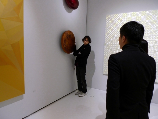 The SCAI the Bathhouse space was much more crowded, especially at the preview. Here a visitor purchases an untitled work by Anish Kapoor.