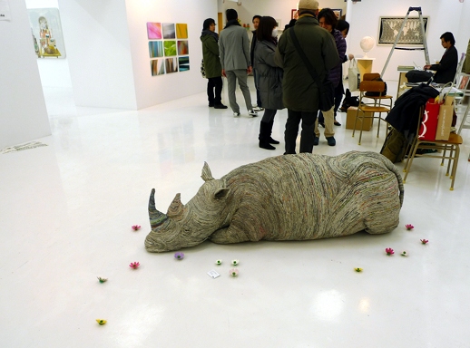 In the 'Exchange' presentations space downstairs, a rhino sculpture by Chie Hitotsuyama lay on the ground surrounded by flowers.