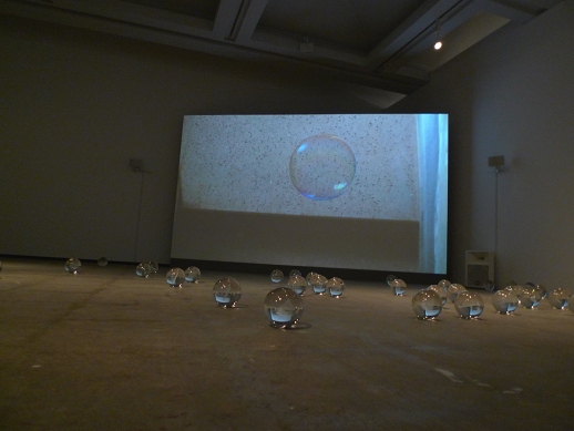Another duo. In this case it is Ryan Gander's crystals, 'A sheet of paper on which I was about to draw, as it slipped from my table and fell to the floor' (2008), with 'O inquilino / The Tenant' (2010), a video work by Rivane Neuenschwander, in the background.