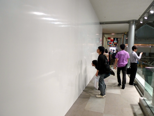 Atsushi Saga's minimalist 'Still White — Corridor' (2011) frankly baffled visitors. The mirror effect is due to the artist's craftsman-like, constant polishing of the painted surface.