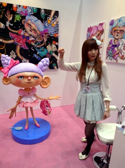Chiaki Kohara was drawing attention for her cosplay style and super-kawaii sculpture and paintings at the DMO Arts booth from Osaka.
