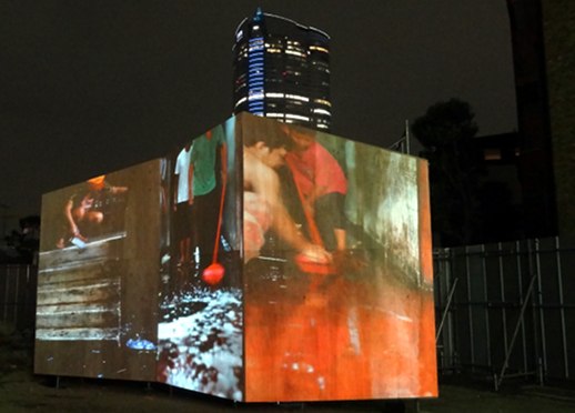 Projected on three connected large screens, Iwai's video documents the cleaning of a derelict building in Phnom Penh, Cambodia, highlighting some of the local social issues.
