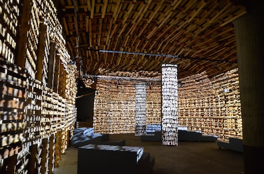 Tadashi Kawamata's installation of wooden pallets for most of this installation’s construction, with animated projections by Keisuke Takahashi (2014). Installation view, BankART Studio NYK.